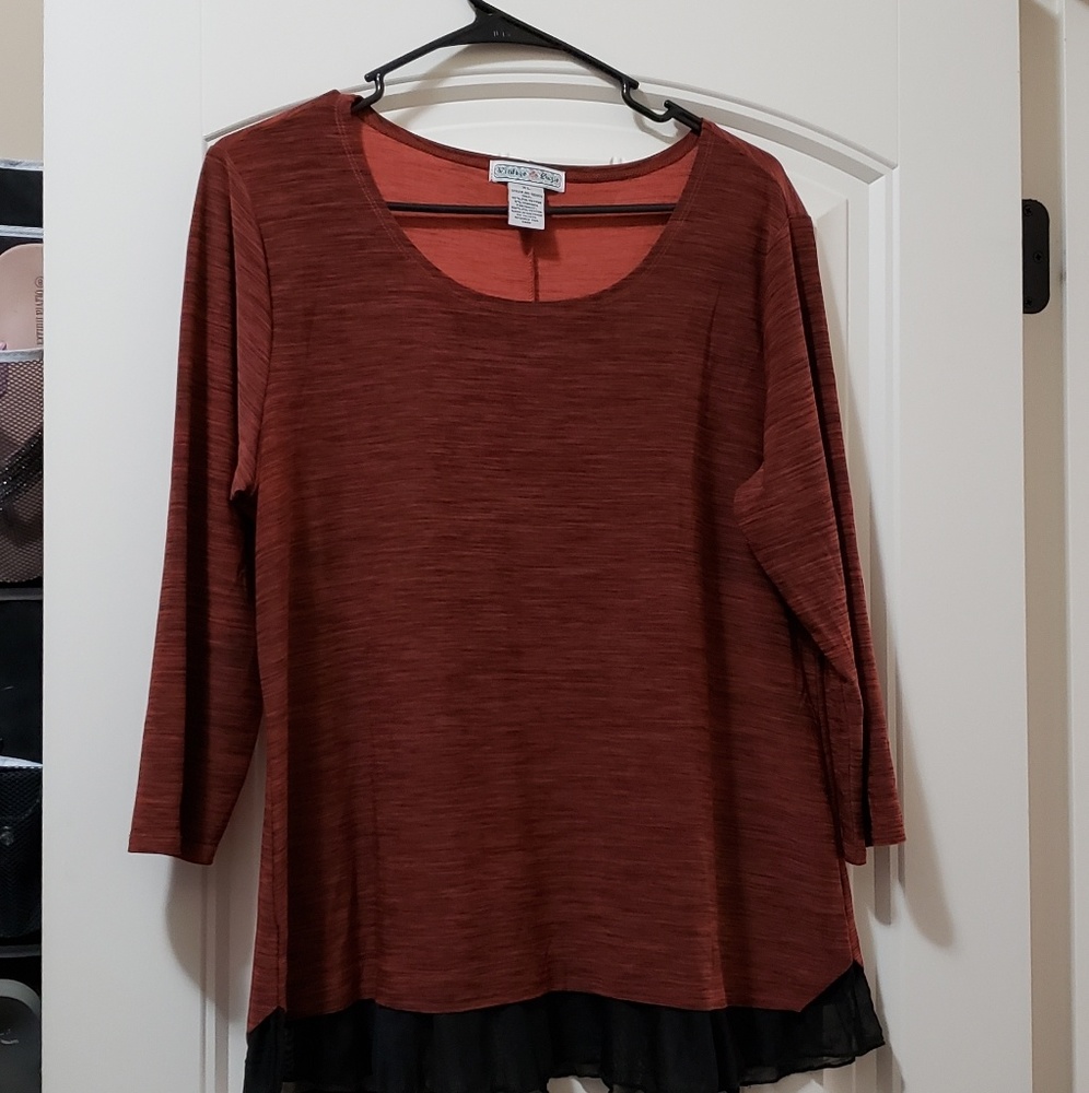 Blouse with ruffle at the bottom